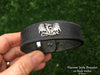 Small Carving Dragon on leather bracelet in hand