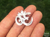 Om Brooch in hand back view