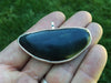 Condor and Big Sur Jade pendant in hand jade view