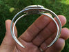 Chief Bracelet large carving side view in hand