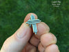 Cross Lapel Pin in hand