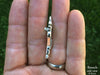 Crossbow Brooch in hand side view
