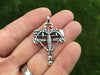 Crossbow pendant in hand