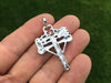 Crossbow Pendant back view in hand