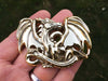 Brass Dragon Buckle in hand