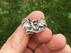 dragon cuff link in hand