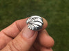 Eagle Head Tie Tack in hand