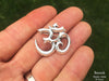 Om Brooch in hand