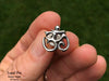 Om lapel Pin in hand