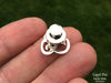Om lapel Pin in hand back view