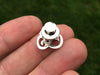 Om tie tack in hand back view
