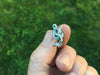 Sea Serpent Tie Tack in hand