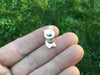 Sea Serpent lapel Pin in hand back view