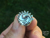 Sun Wave Lapel Pin sterling silver in hand