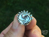 Sun Wave Lapel Pin sterling silver in hand